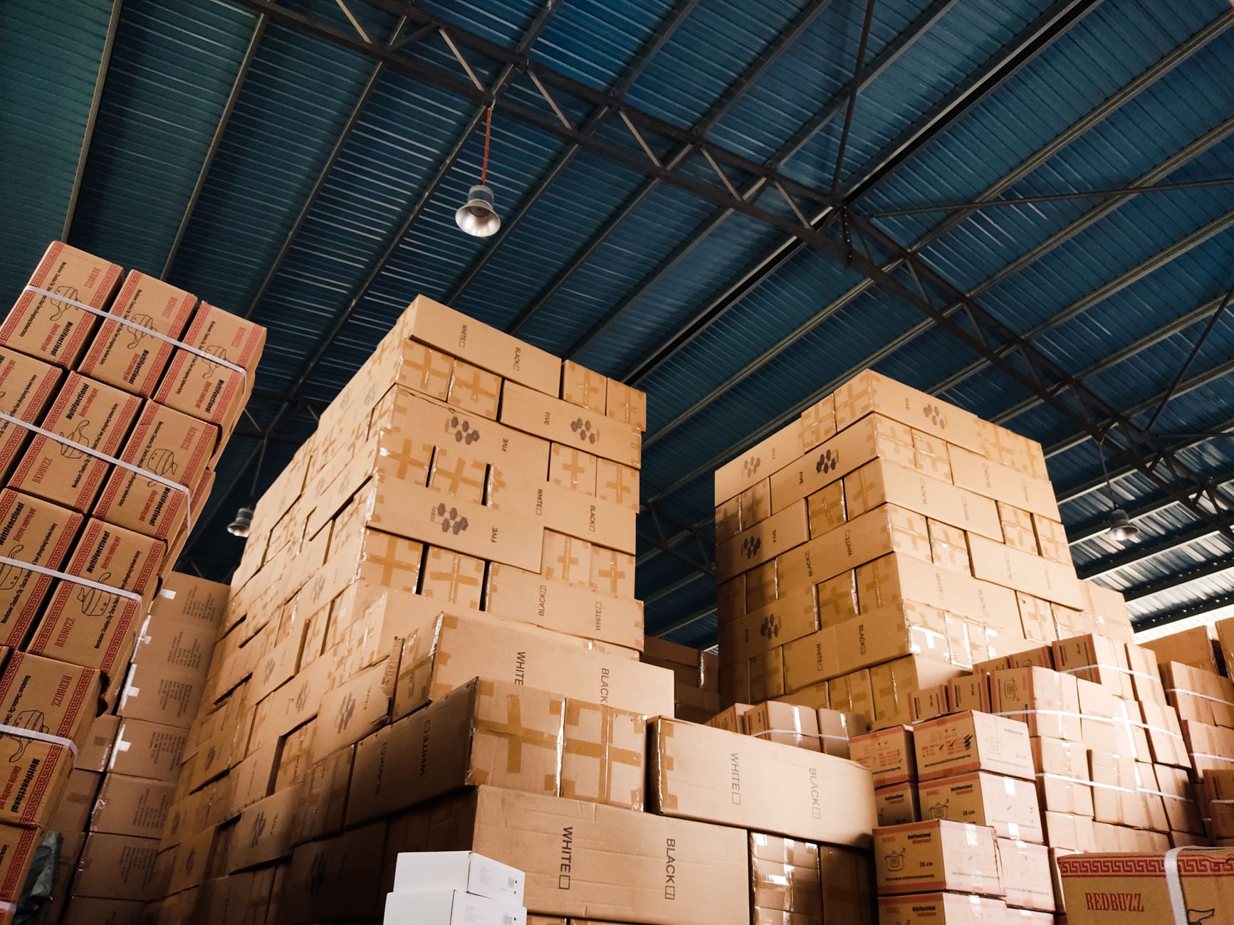 Warehouse setting with stacked eco-friendly packaging supplies